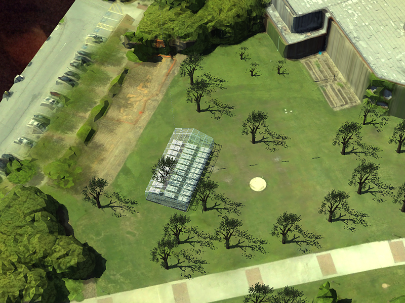 An illustration of an overhead shot of a greenhouse on a grassy lawn.