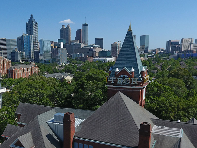 An image of the Georgia Tech campus with the Atlanta skyline in the background.